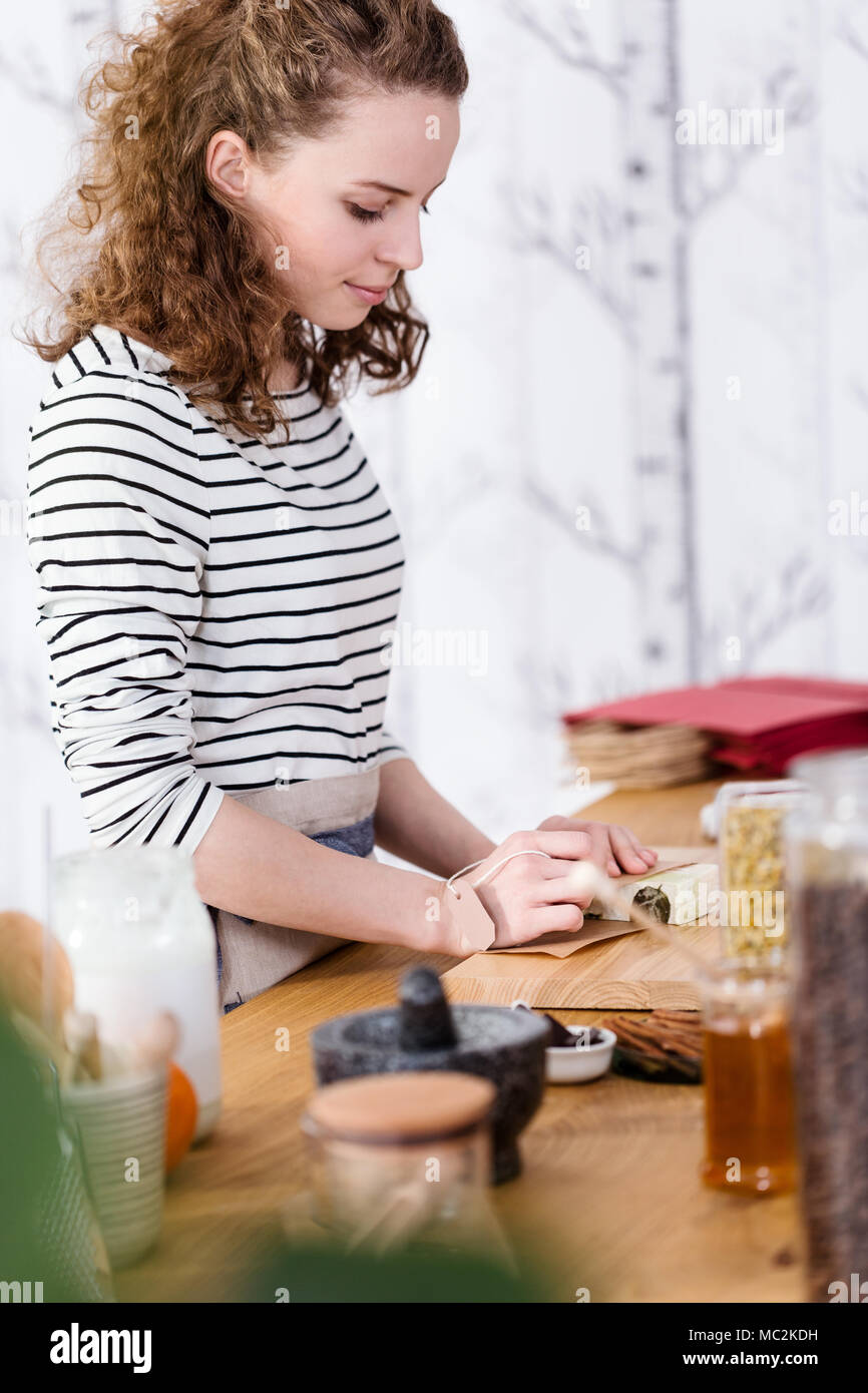 Woman packing natural soap for sale in the online store Stock Photo