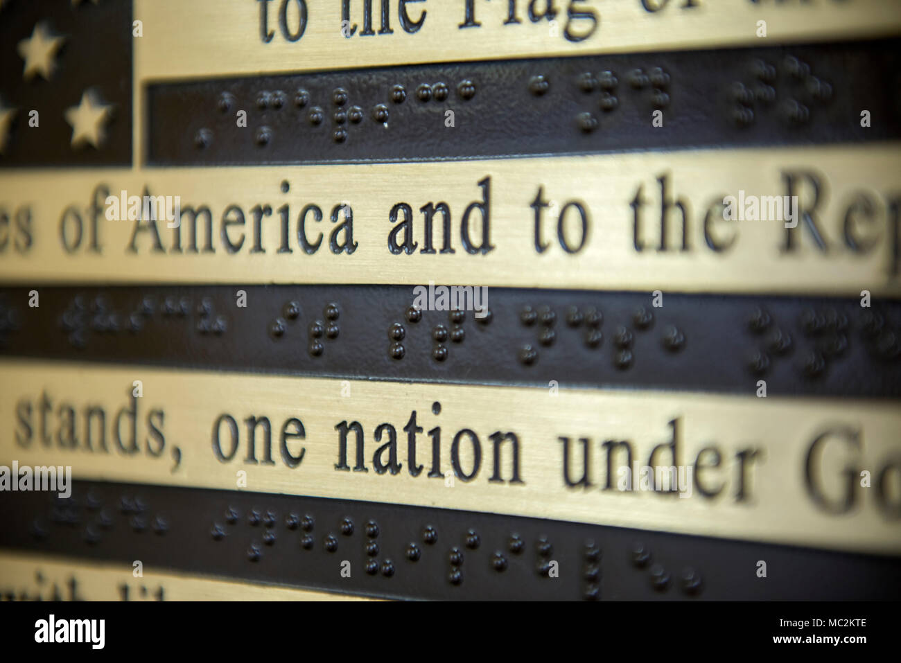 The American Braille tactile flag in the Welcome Center at Arlington National Cemetery, Arlington, Virginia, Jan. 26, 2018.  In 2008, the 110th Congress passed H.R. 4169, which authorized the placement of the Braille Flag at ANC in honor of blind members of the Armed Forces, veterans, and other Americans.  The Braille Flag can be found inside the ANC Welcome Center near the Arlington Tours ticket center.  (U.S. Army photo by Elizabeth Fraser / Arlington National Cemetery / released) Stock Photo