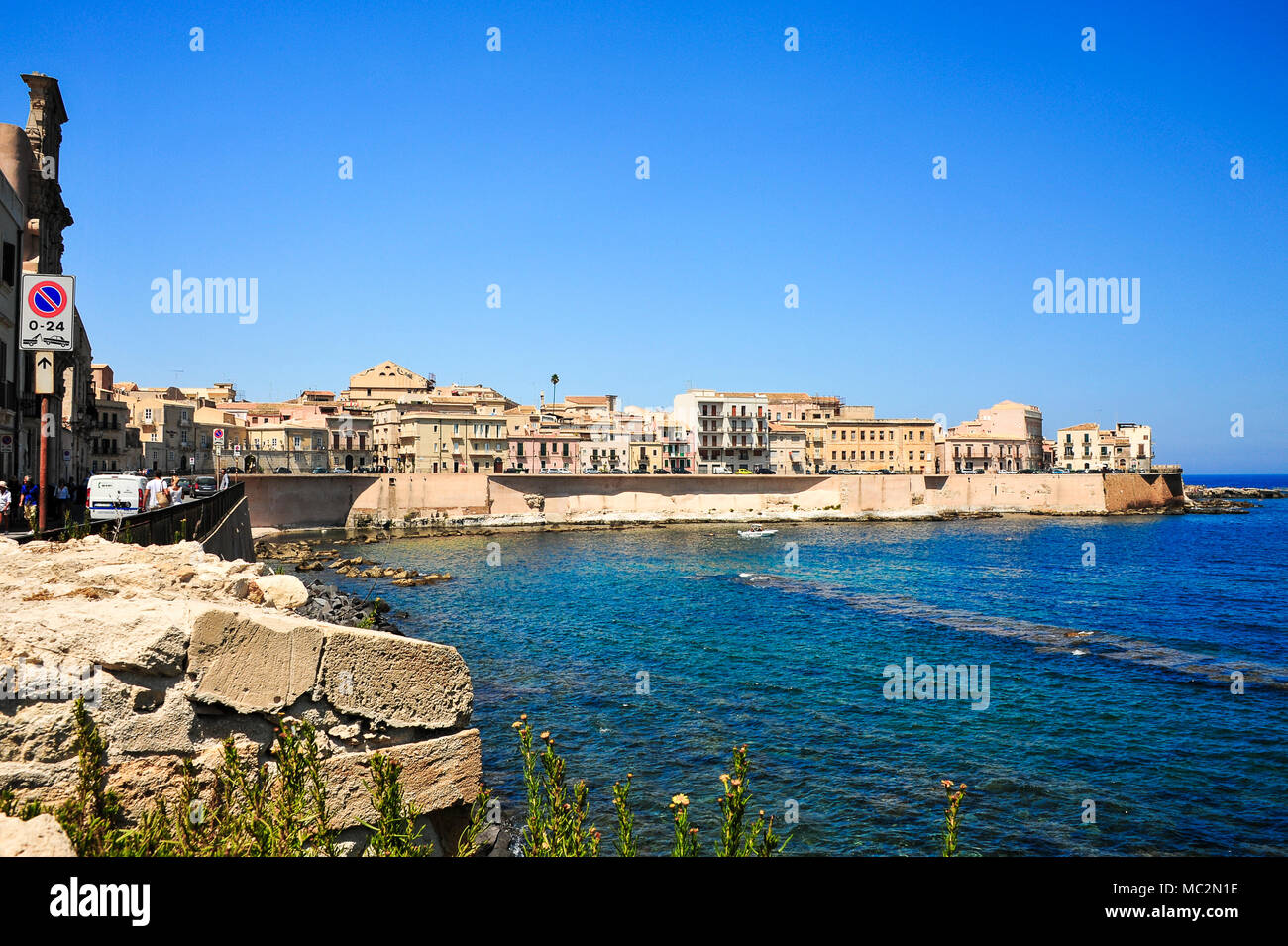 Houses along the sea wall and Mediterranean views on the the island of Ortigia, Siracuse, Sicily Stock Photo