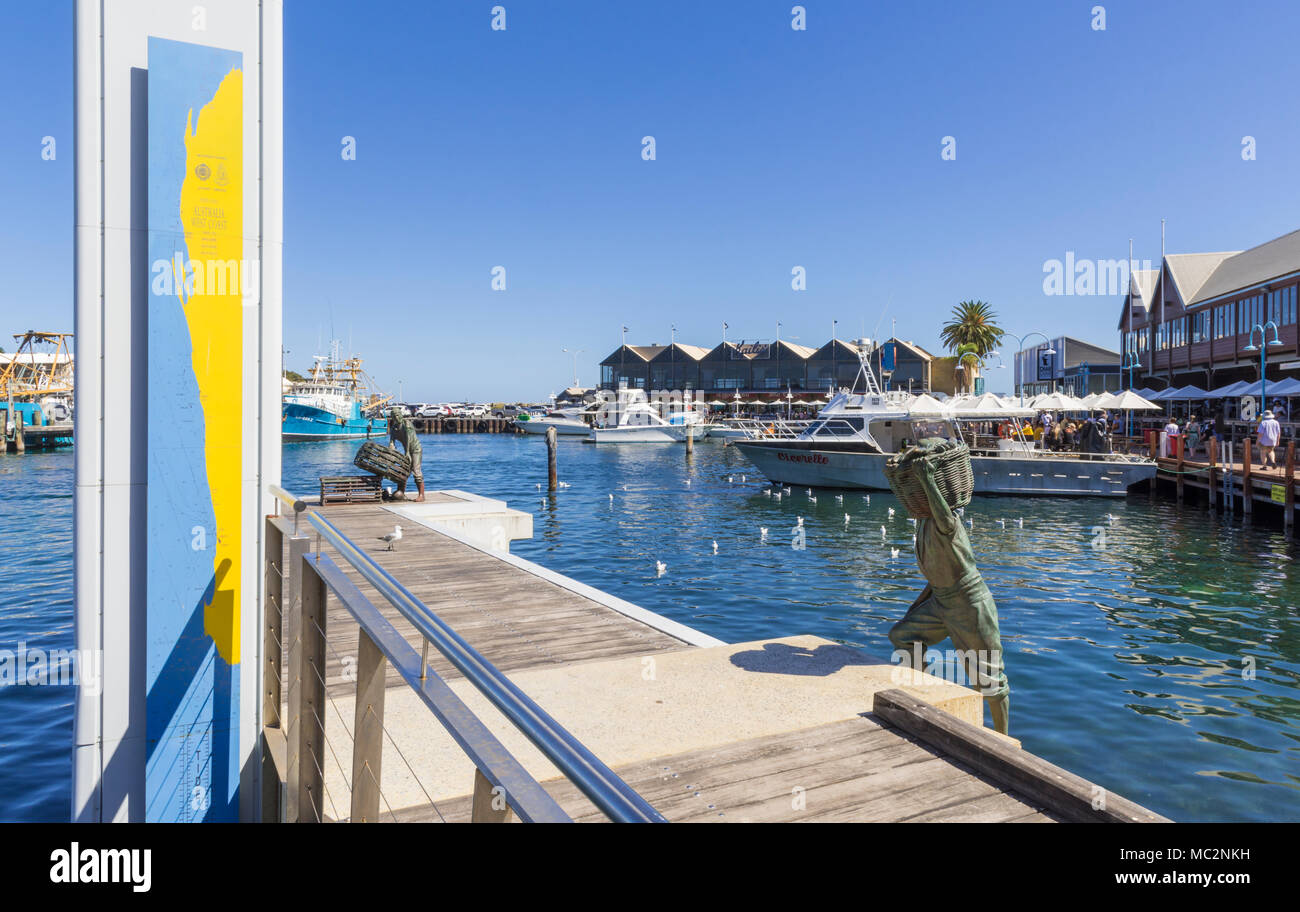 Fremantle Fishing Boat Harbour jetty and Fishermen memorial with views over to the waterfront restaurants, Fremantle, Western Australia, Australia Stock Photo