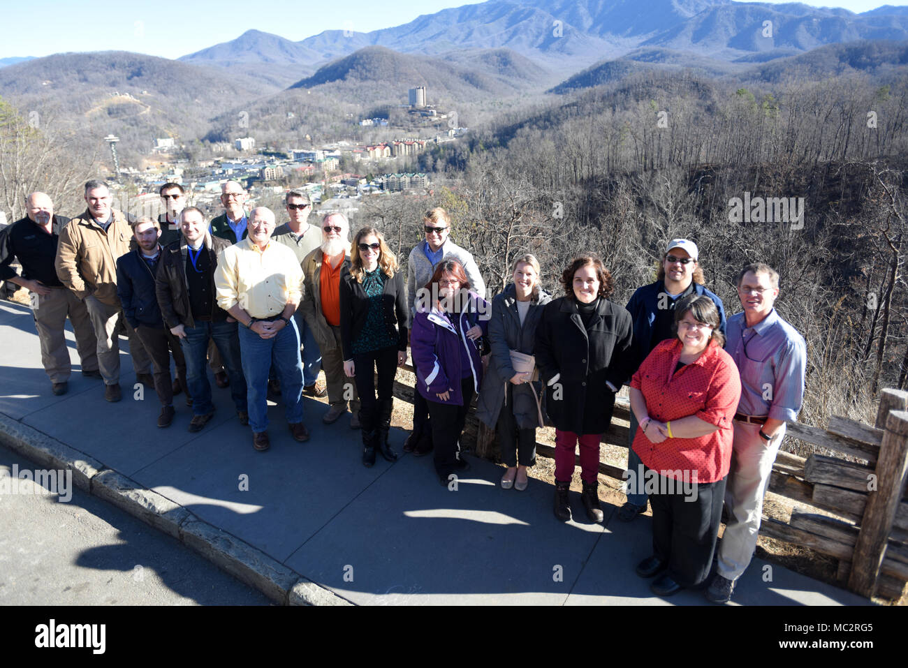 Members of Tennessee Silver Jackets pose at the Gatlinburg Bypass Overlook overlooking Gatlinburg, Tenn., Jan. 25, 2018.  The team toured the area and received a briefing on the wildfires that moved through Sevier County and city of Gatlinburg in November 2016. Silver Jackets is an innovative partnership where local, state and federal agencies facilitate flood risk reduction, coordinates programs, promotes cohesive solutions, synchronizes plans and policies, and ultimately provides integrated solutions. (USACE photo by Leon Roberts) Stock Photo