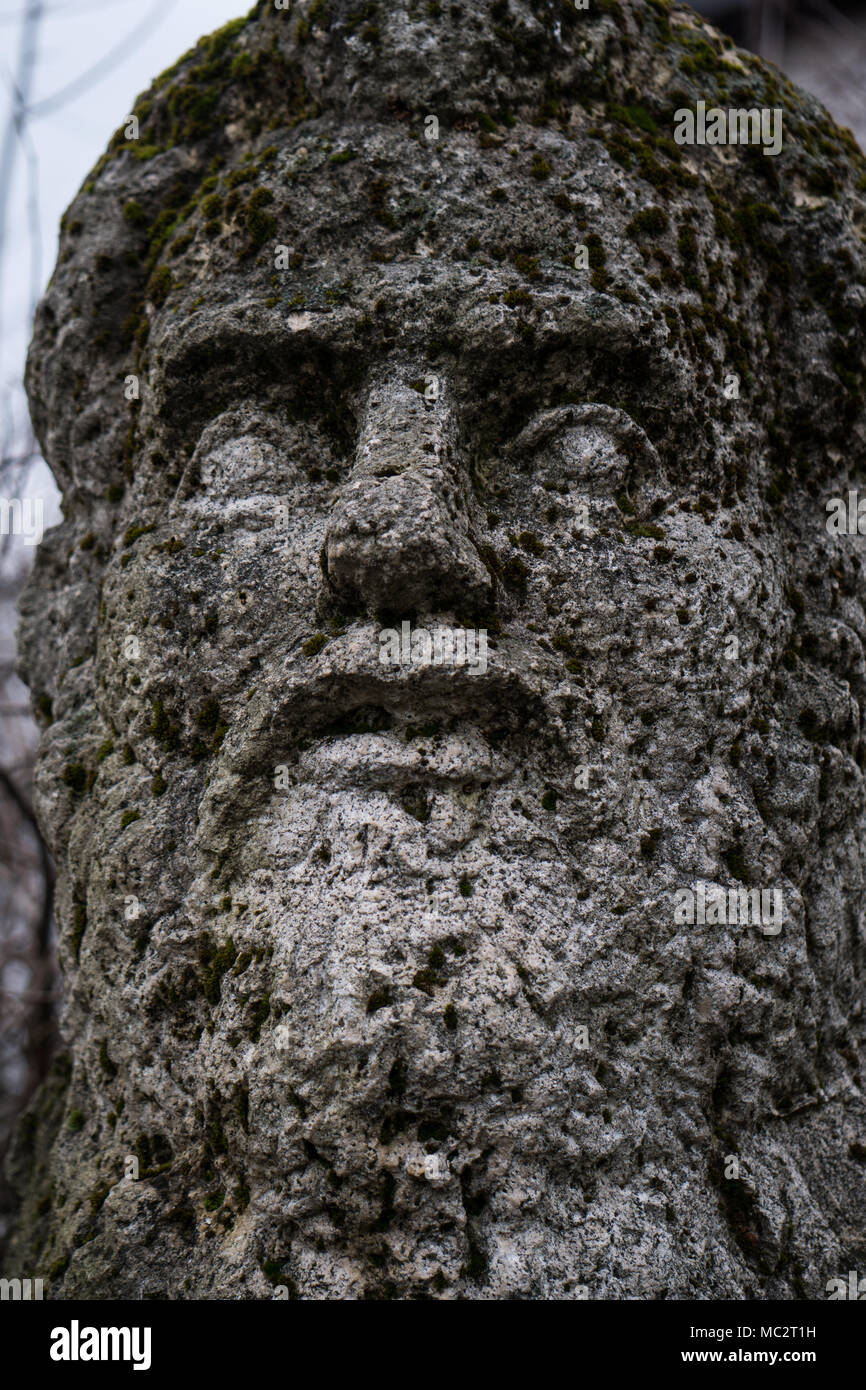 Stone carved face of Creanga, in the yard of his former house Stock Photo