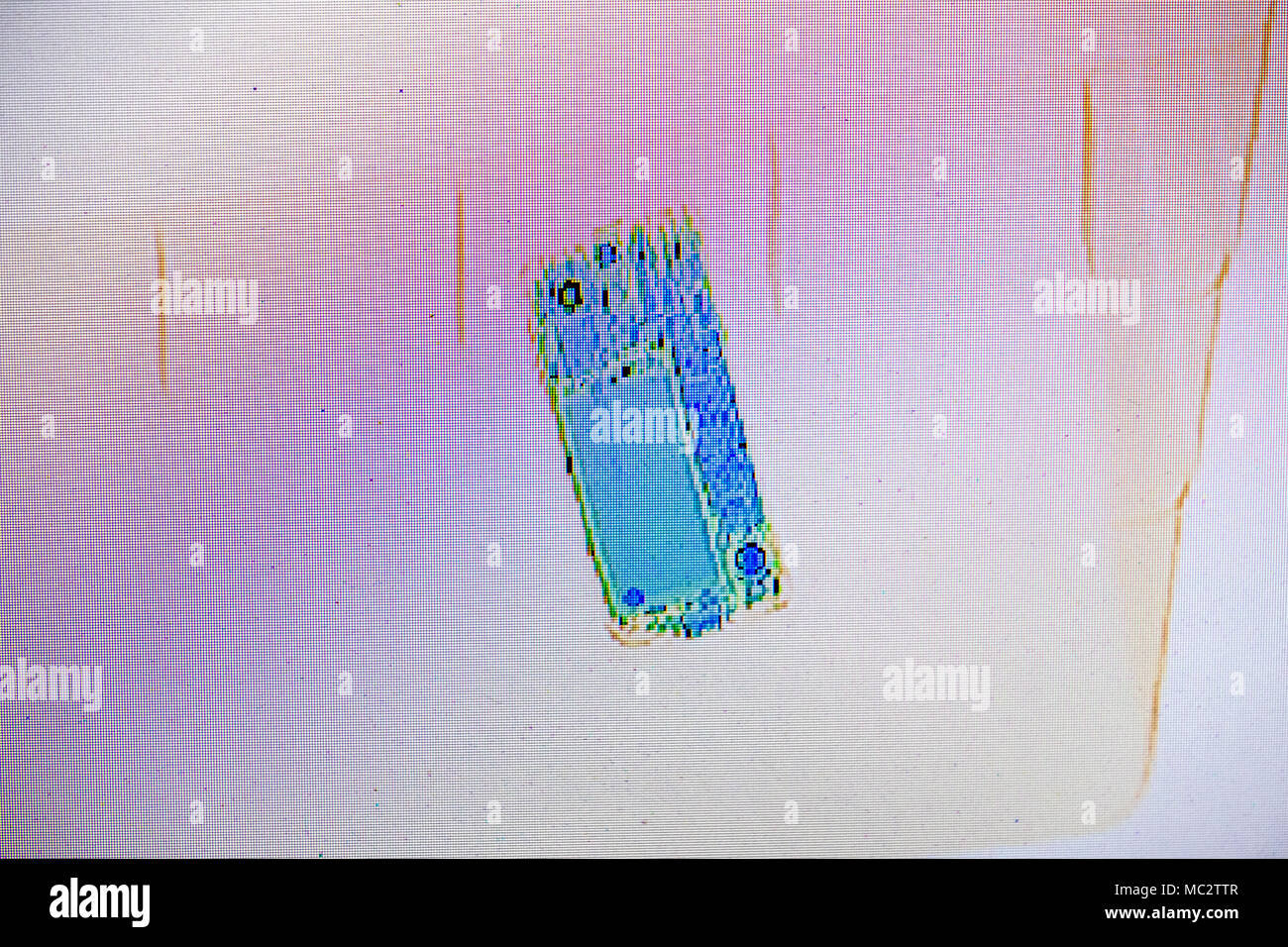 X-ray screenshot of a bag with a smartphone. Stock Photo