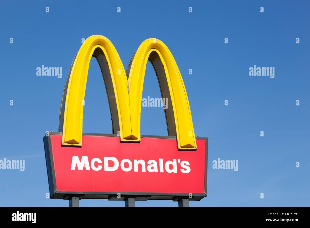 Stilling, Denmark - August 9, 2015: McDonald's logo on a pole. McDonald's is the world's largest chain of hamburger fast food restaurants Stock Photo