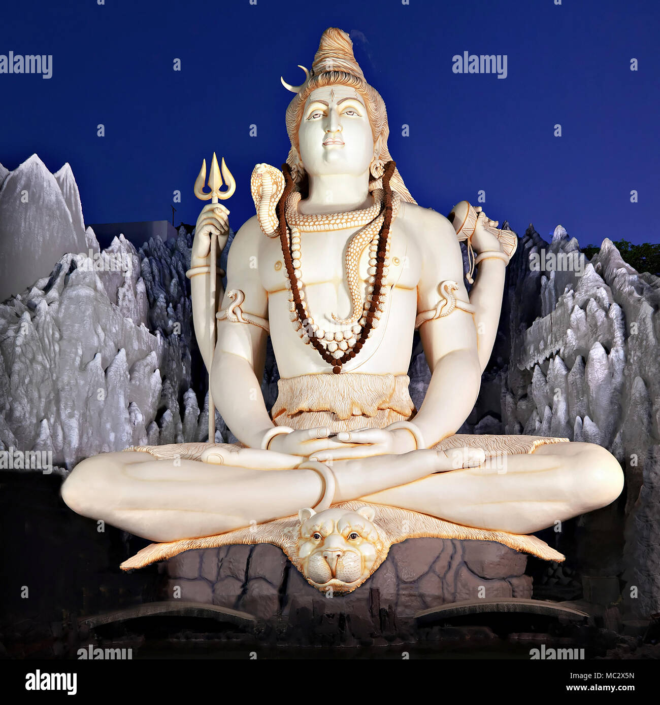 Lord Shiva big statue sitting in lotus pose with trident in Murugeshpalya Temple in Bangalore, India. This Shiva Statue is highest in the world. Stock Photo