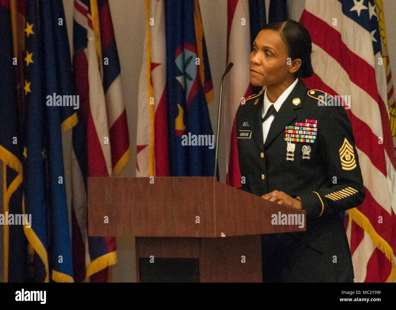 Command Sgt. Maj. Cheryl Greene, command sergeant major, 13th Expeditionary Sustainment Command presents a speech to noncommissioned officers during a U.S. Army Noncommissioned Officer Induction ceremony welcoming newly-inducted NCOs to the corps at Sage Hall, Fort Bliss, Texas, Jan. 24. Over 50 NCOs belonging to the 31st Combat Support Hospital and William Beaumont Army Medical Center were inducted to the NCO Corps. Stock Photo