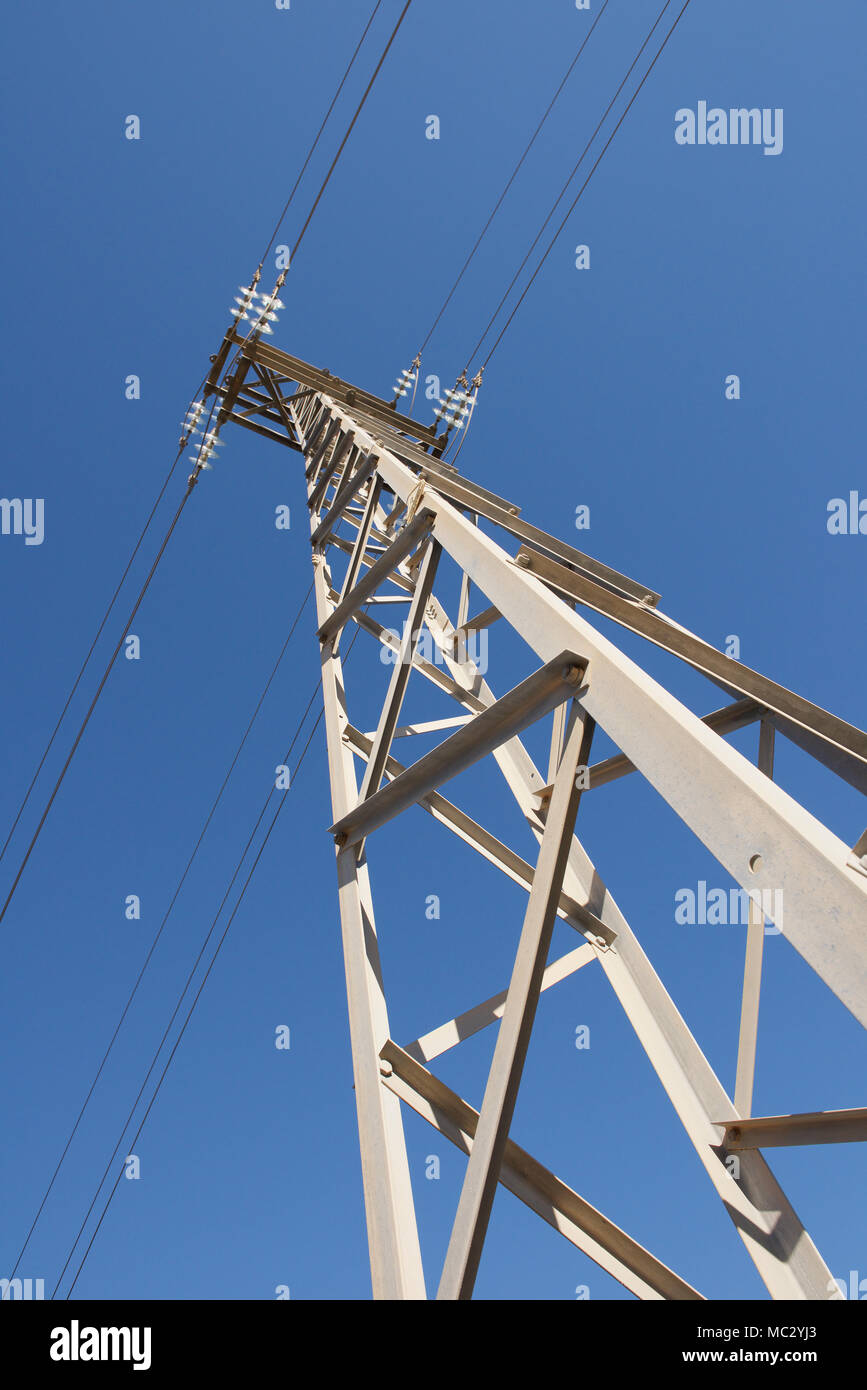 Electricity pylon against a blue sky Stock Photo - Alamy