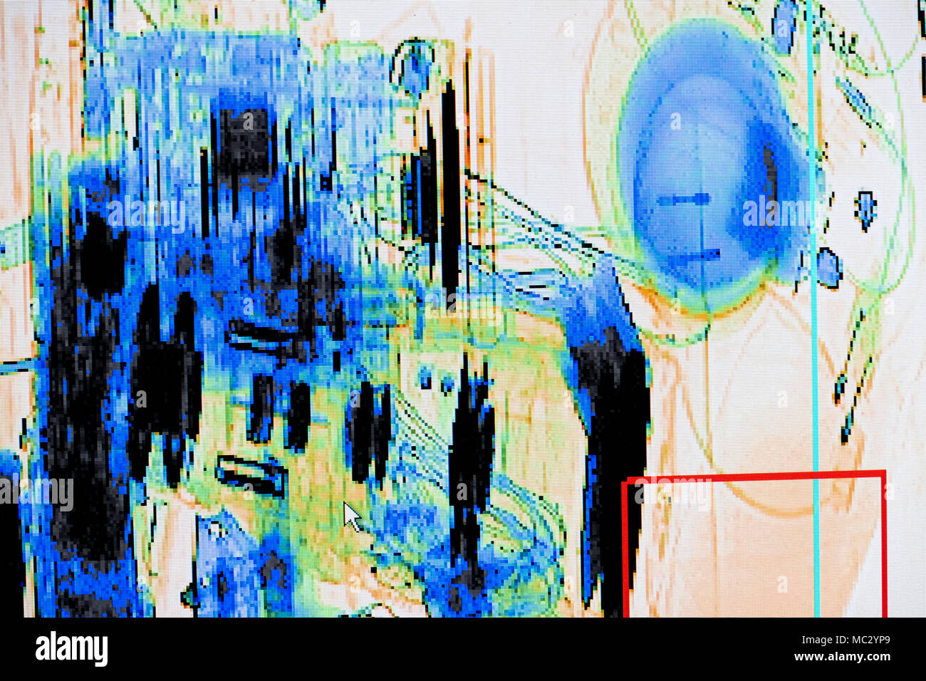 X-ray screenshot of an backpack filled with tele zoom camera and camcorder. Stock Photo