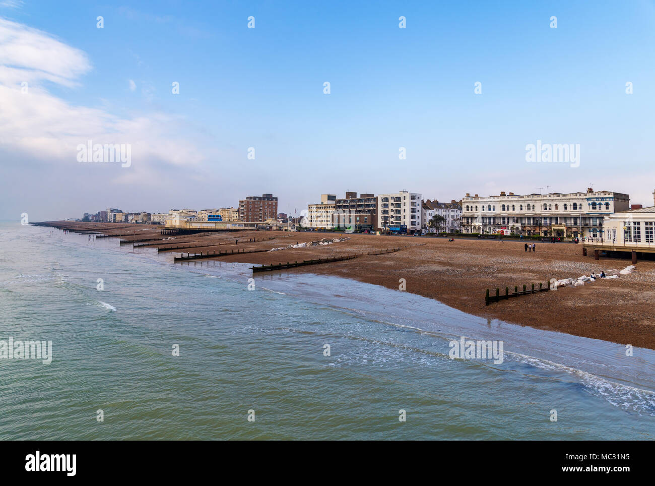 Worthing, West Sussex, England, UK - October 25, 2016: Worthing beach, seen from the pier, with clouds coming from the sea Stock Photo