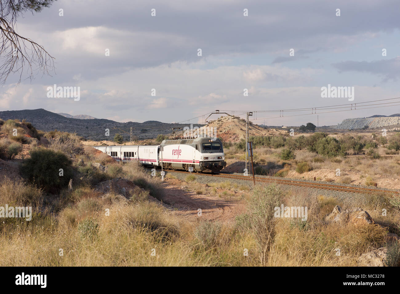 Renfe passenger train in the countryside of Spain Stock Photo - Alamy