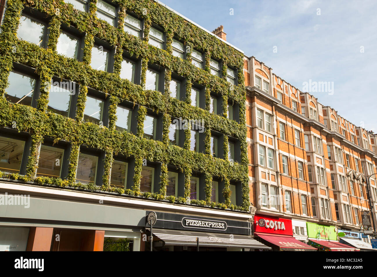 A green fronted building using plants on Kingsway, London, UK. Stock Photo