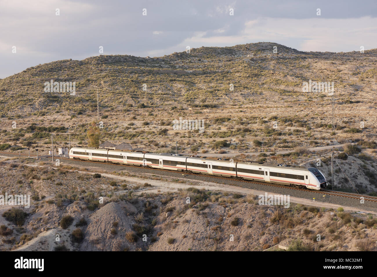 Renfe passenger train in the countryside of Spain Stock Photo - Alamy