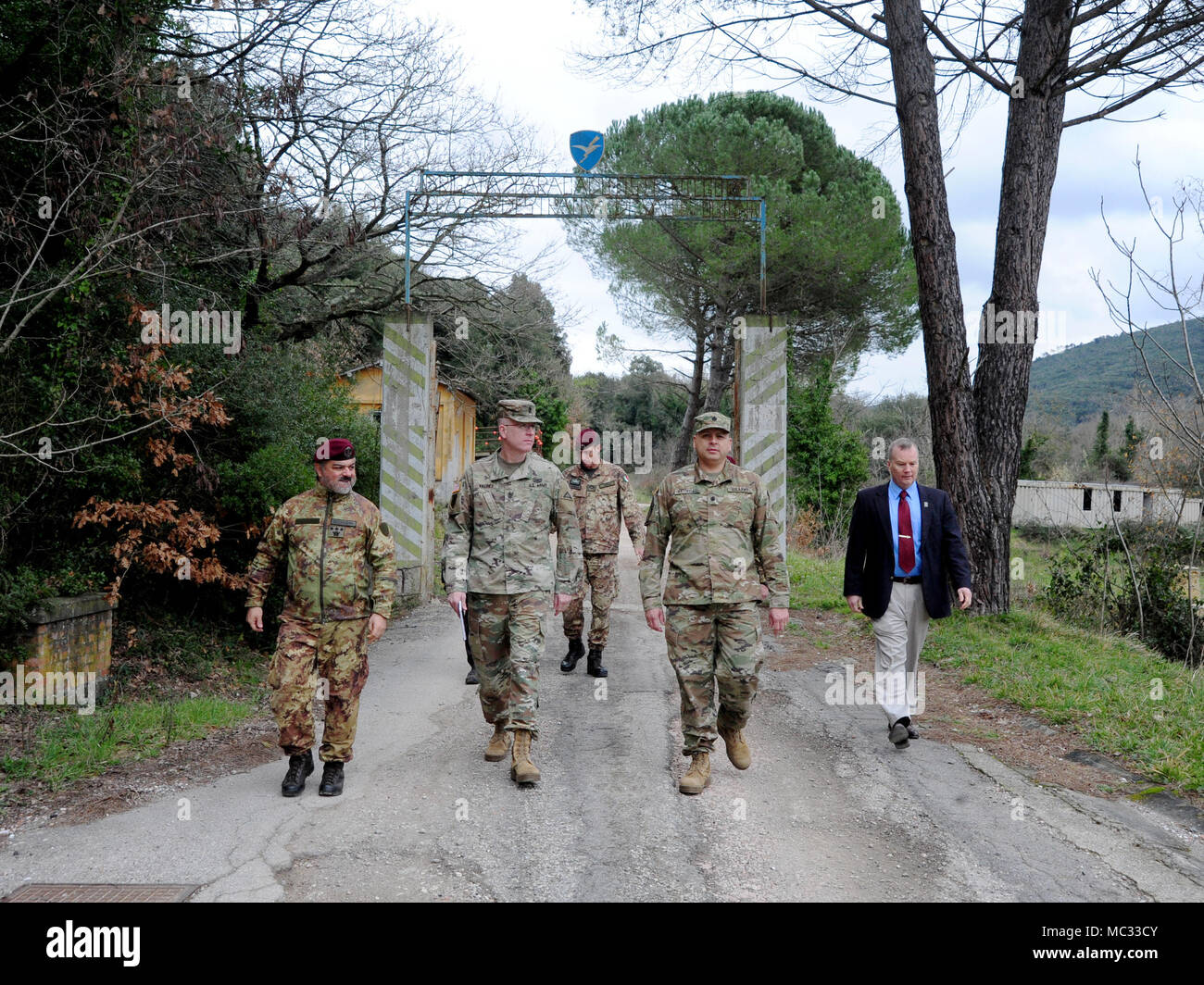 (From left) Italian Army Col. Marco Becherini, Folgore (ABN) Brigade Training Center Commander, U.S. Army Sgt. Maj. Anthony R. Valdez, 7 Army Training Command G-3 Sergeant Major, U.S. Army Lt.Col. Ismael B. Natividad, Training Support Activity Europe (TSAE) Director, and James V. Matheson, Chief Regional Training Support Division South, 7th Army Training Command, during the TSAE Director visit at Valle Ugione Training Area, Livorno, Italy, Jan 30, 2018. (photo by Vincenzo Vitiello/released). Stock Photo