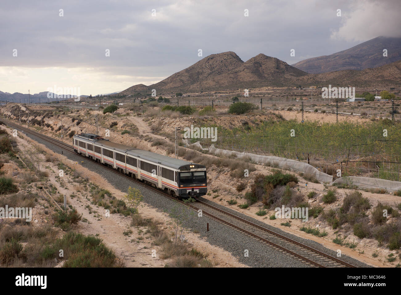 Renfe passenger train in the countryside of Spain Stock Photo - Alamy