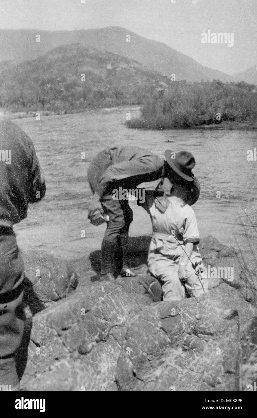 World War I era soldier grabs a kiss from his girlfriend, ca. 1918. Stock Photo