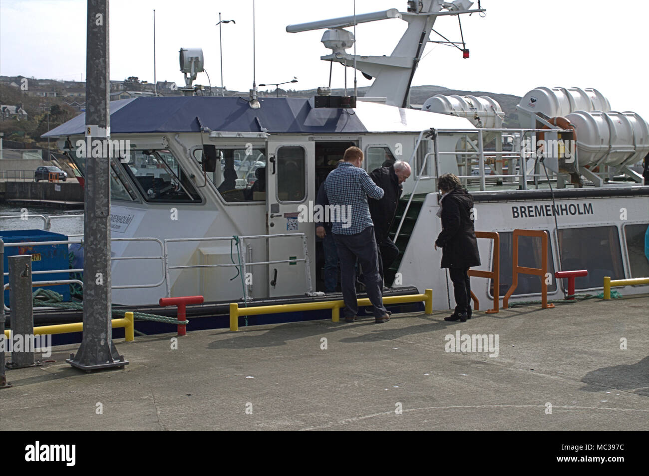 passengers disembarking from the MV Bremenholm, a ferry serving baltimore to cape clare island, a popular tourist destination, west cork, ireland. Stock Photo