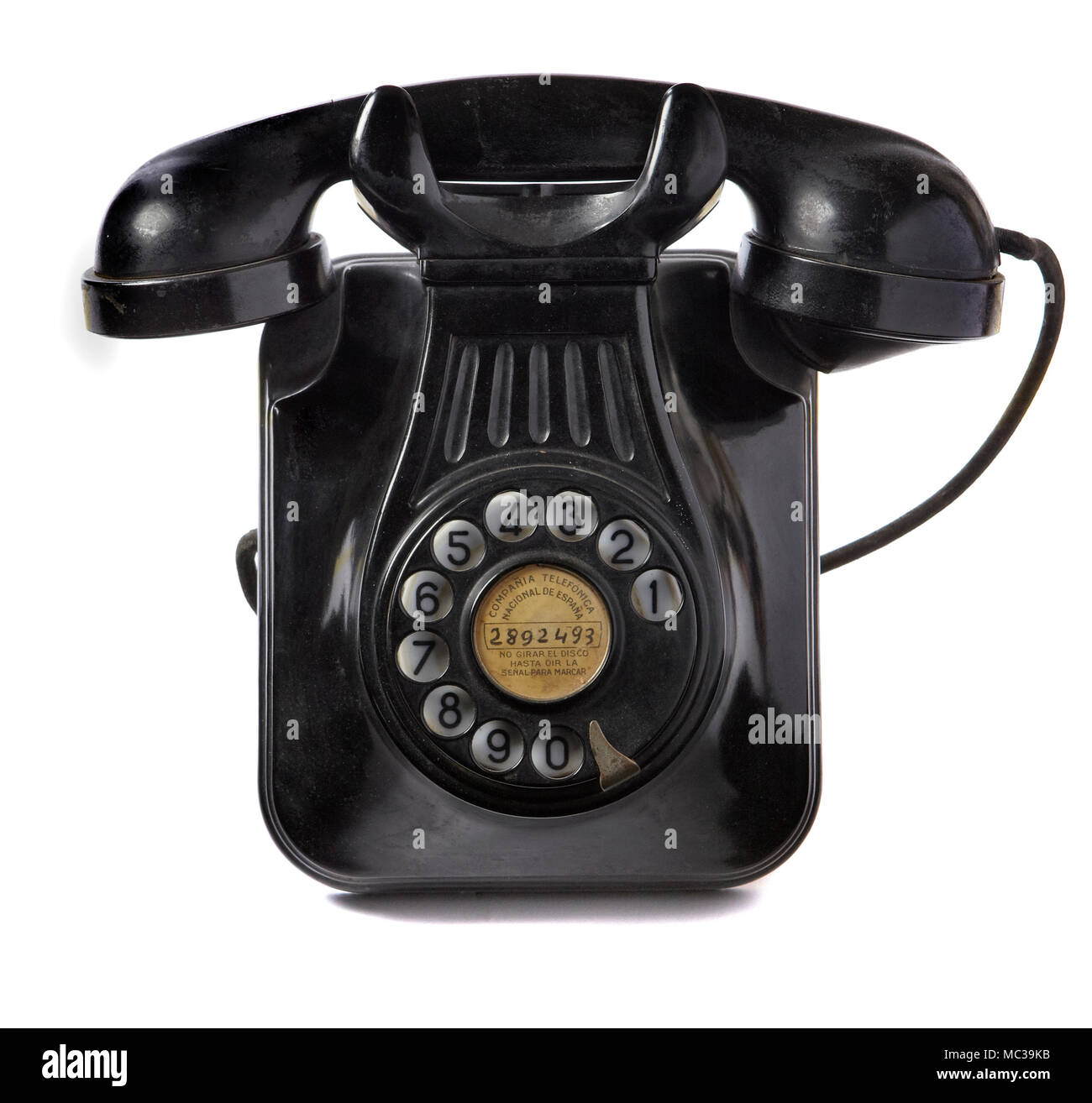 a still life of a vintage wall mounted bakelite art deco 1930 or 1940  telephone on a white background Stock Photo - Alamy