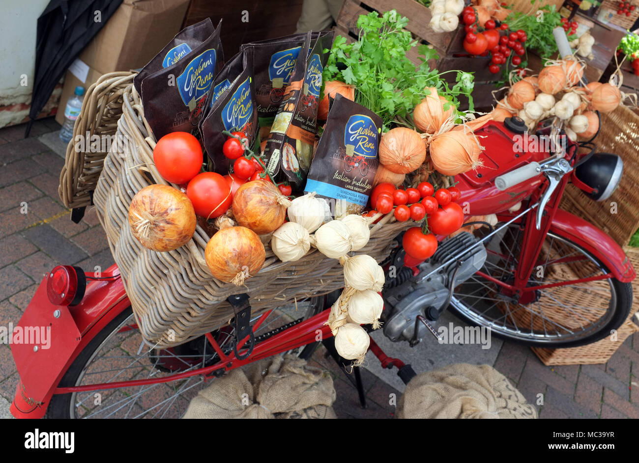 Fruit & Veg display on a vintage motorcycle at a farmers market and food fair stall in England UK Stock Photo