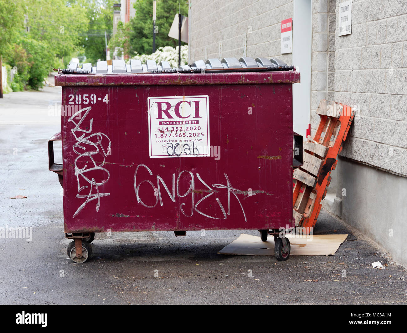 Quebec, Canada. A metal garbage container in a back alley in Montreal Stock  Photo - Alamy