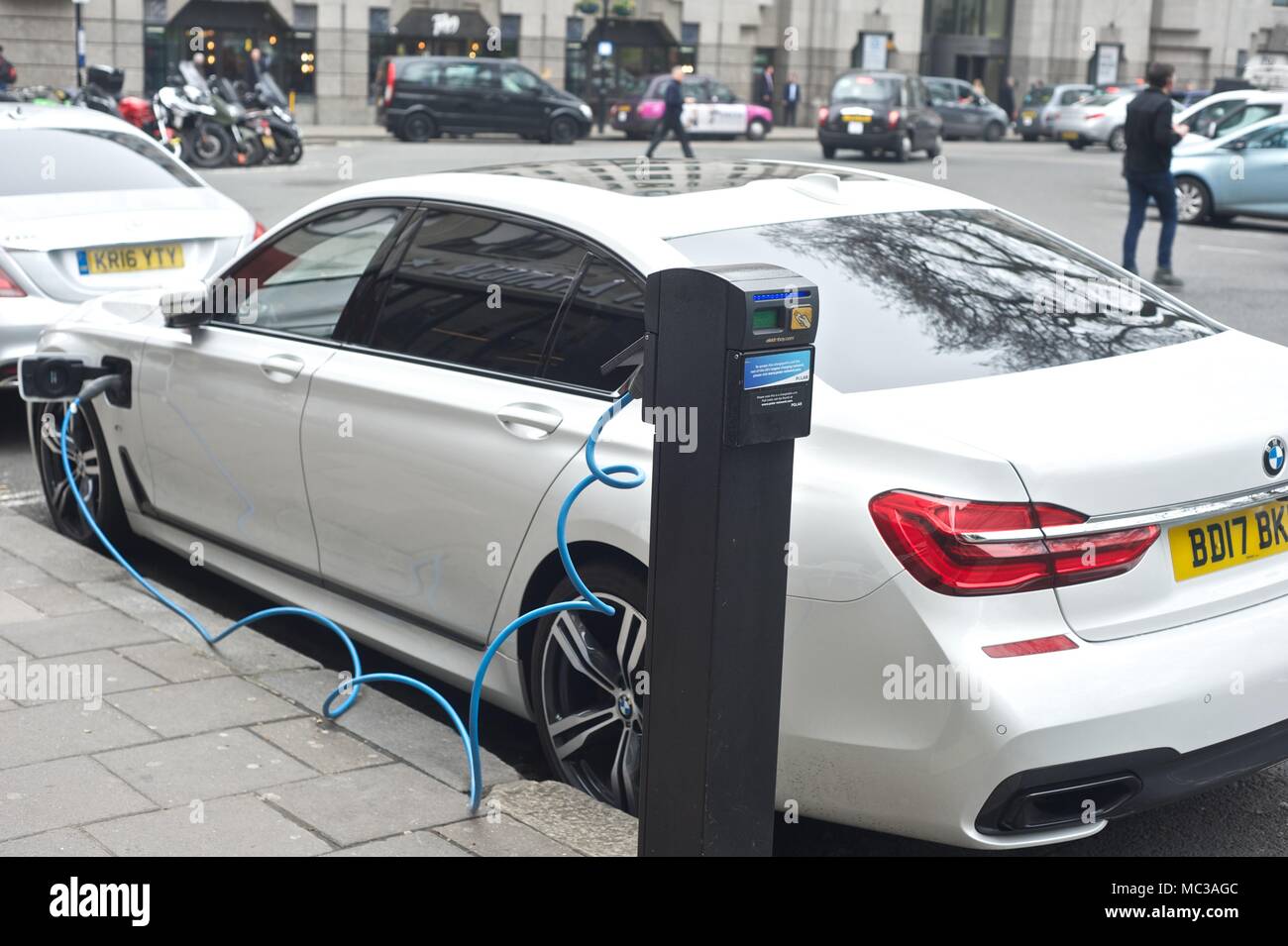 Hybrid, Electric Cars at charging point Stock Photo Alamy
