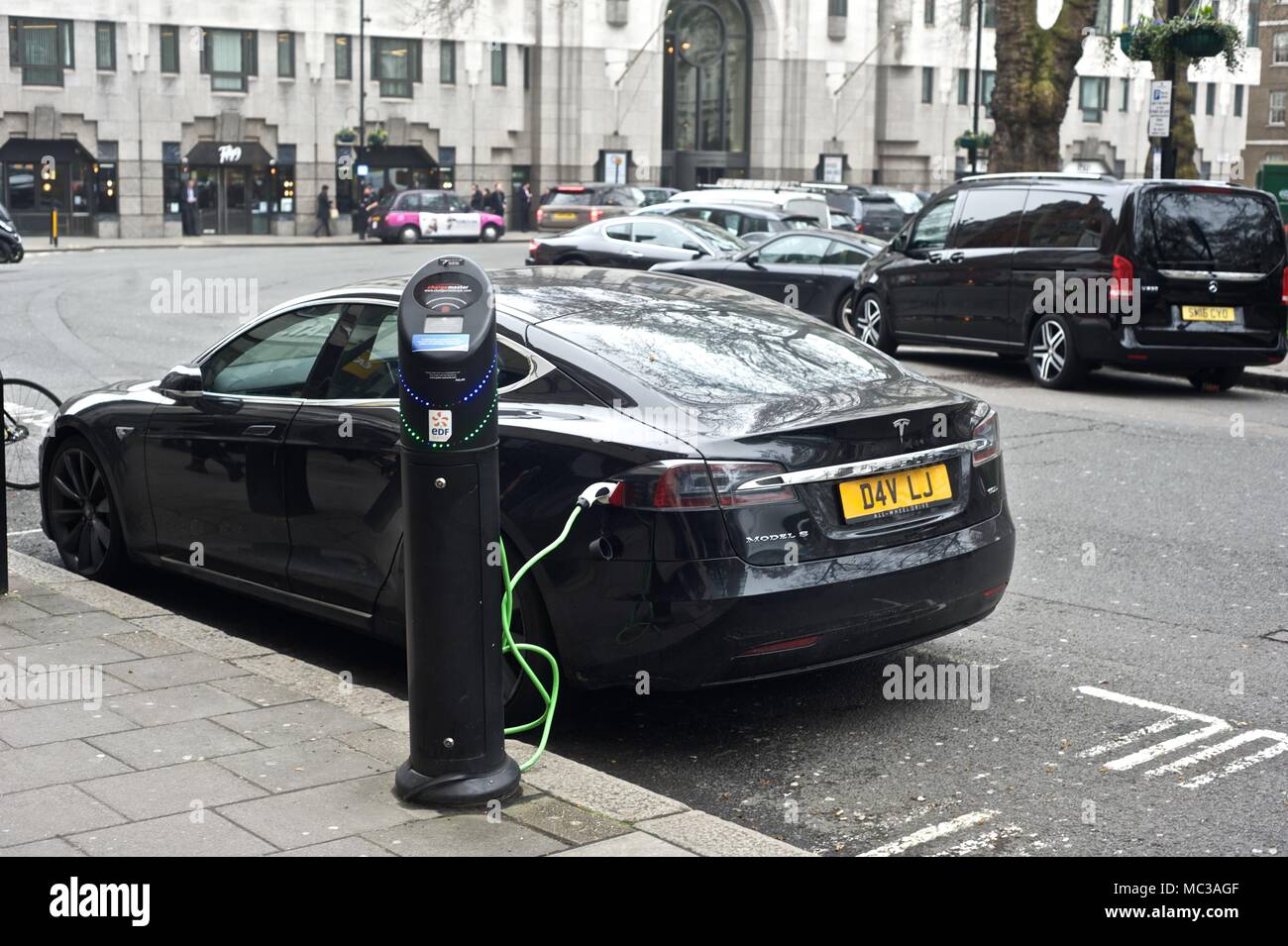 Hybrid, Electric Cars at charging point Stock Photo Alamy