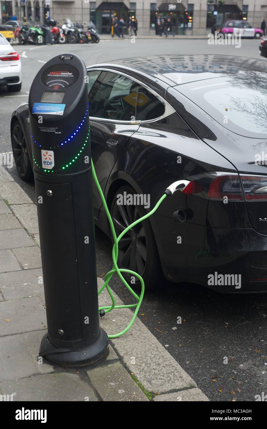 Hybrid, Electric Cars at charging point Stock Photo Alamy