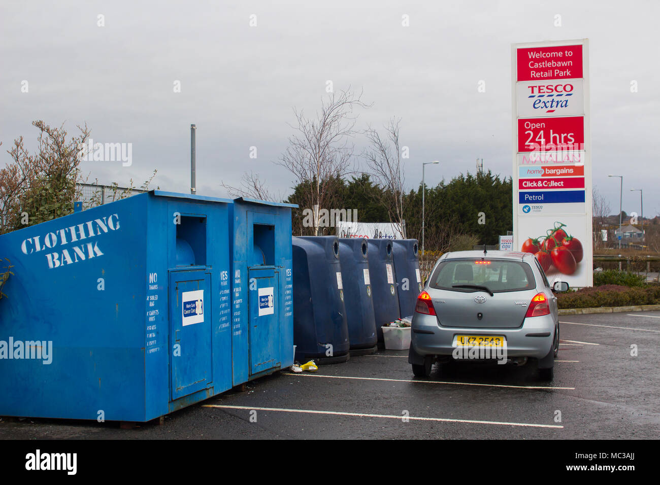 Colourful steel clothing and plastic banks located in the local Tesco