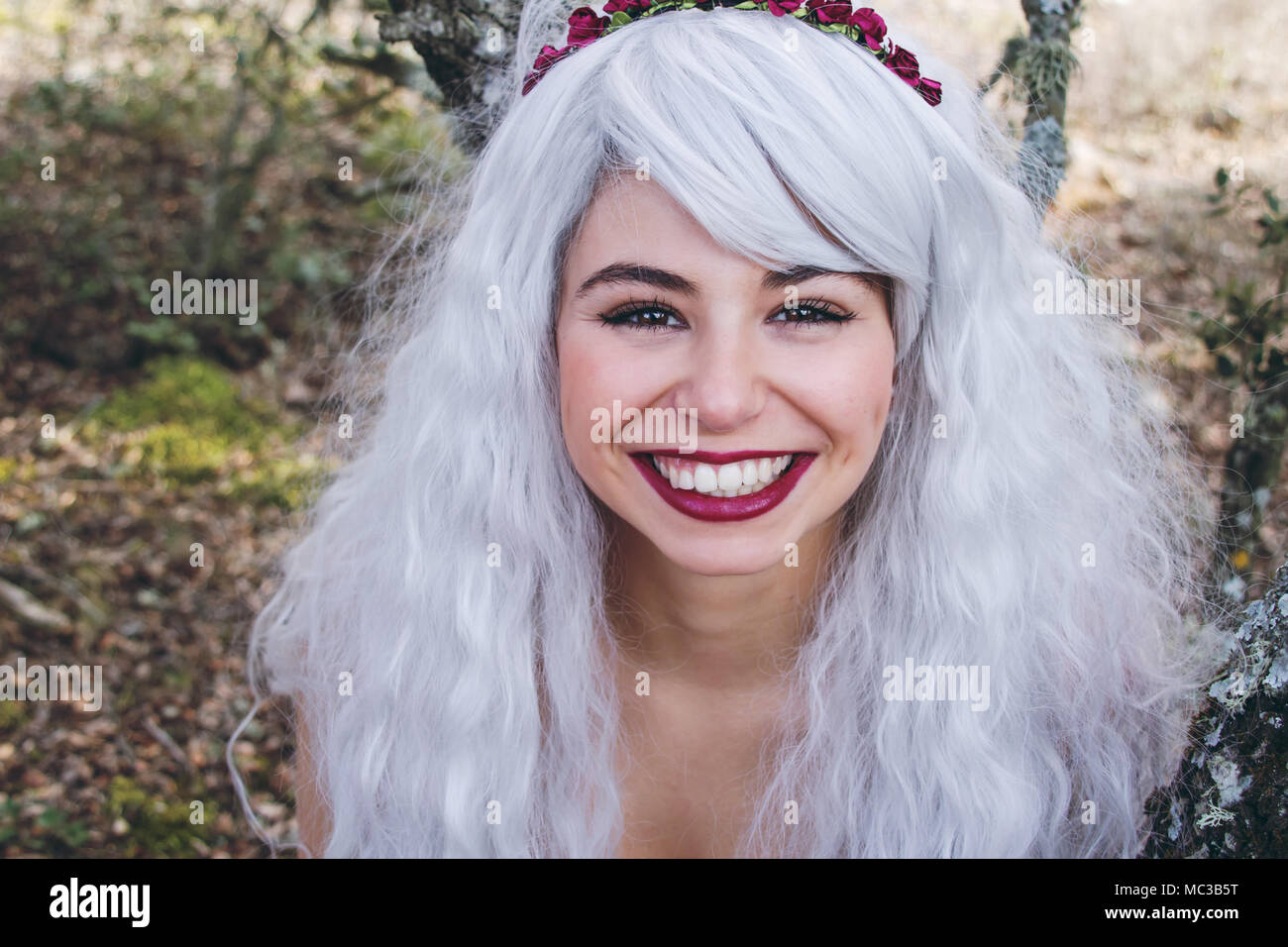 Fairy tale portrait of a young woman in a forest Stock Photo - Alamy