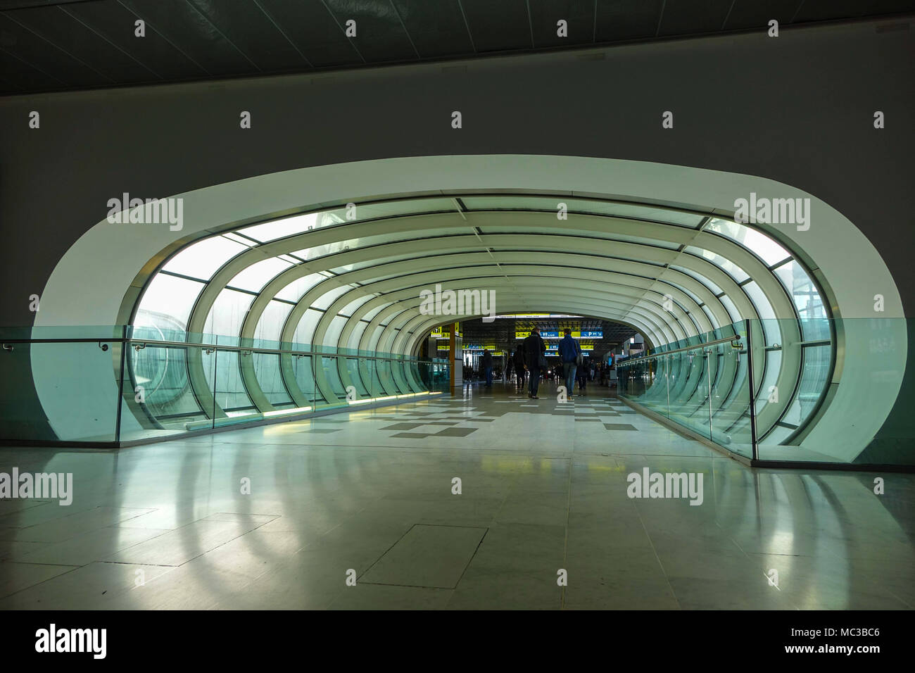 Pedestrian tunnel with people walking through, Toulouse Blagnac airport, France Stock Photo