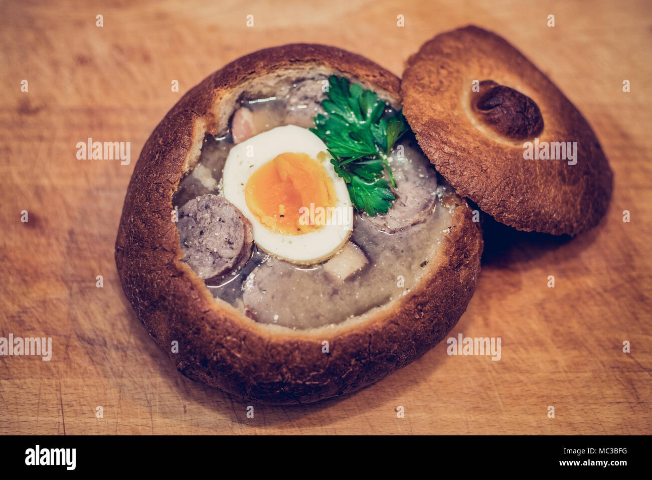 Zurek traditional Polish soup inside a bread Stock Photo Alamy