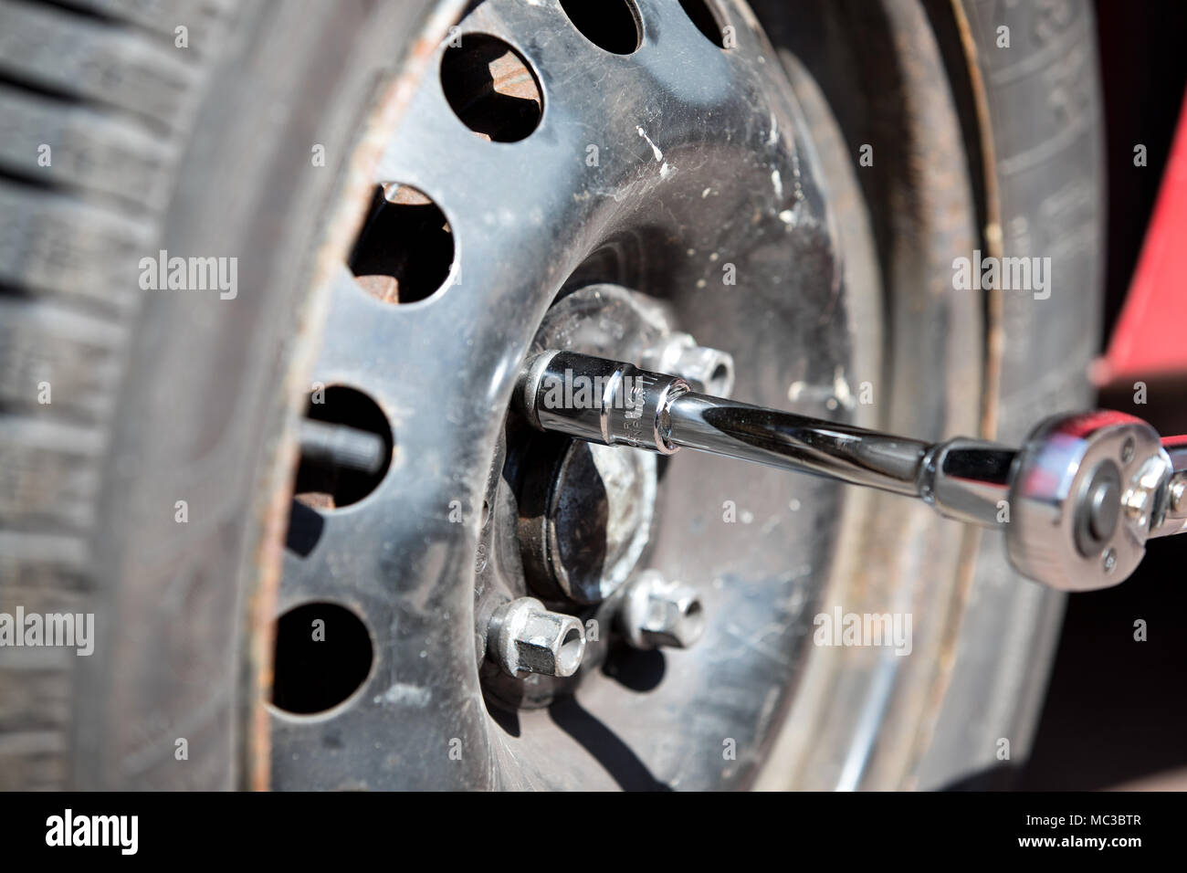 wheel change with torque wrench Stock Photo Alamy