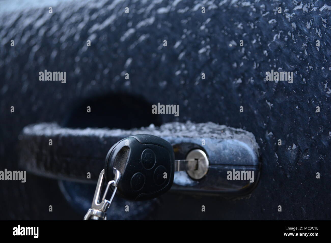 Frozen rain. Extreme weather. Danger for driving. Car locked. Stock Photo