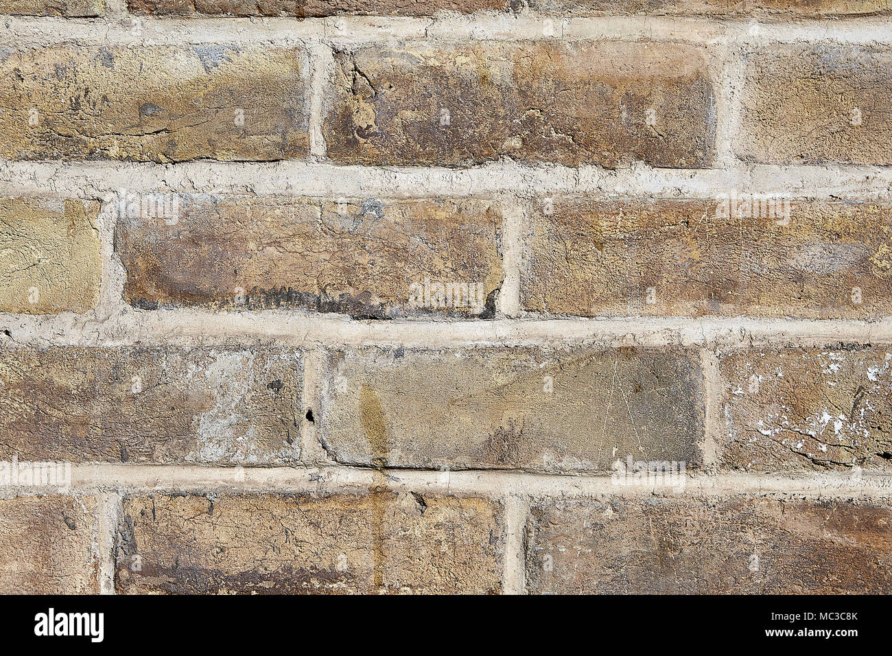 Close Up Fragment Of Brick Wall With An Old Cracked Brick Of Yellow And Light Brown Color Seams Are Smeared With Cement Mortar Textural Background Stock Photo Alamy