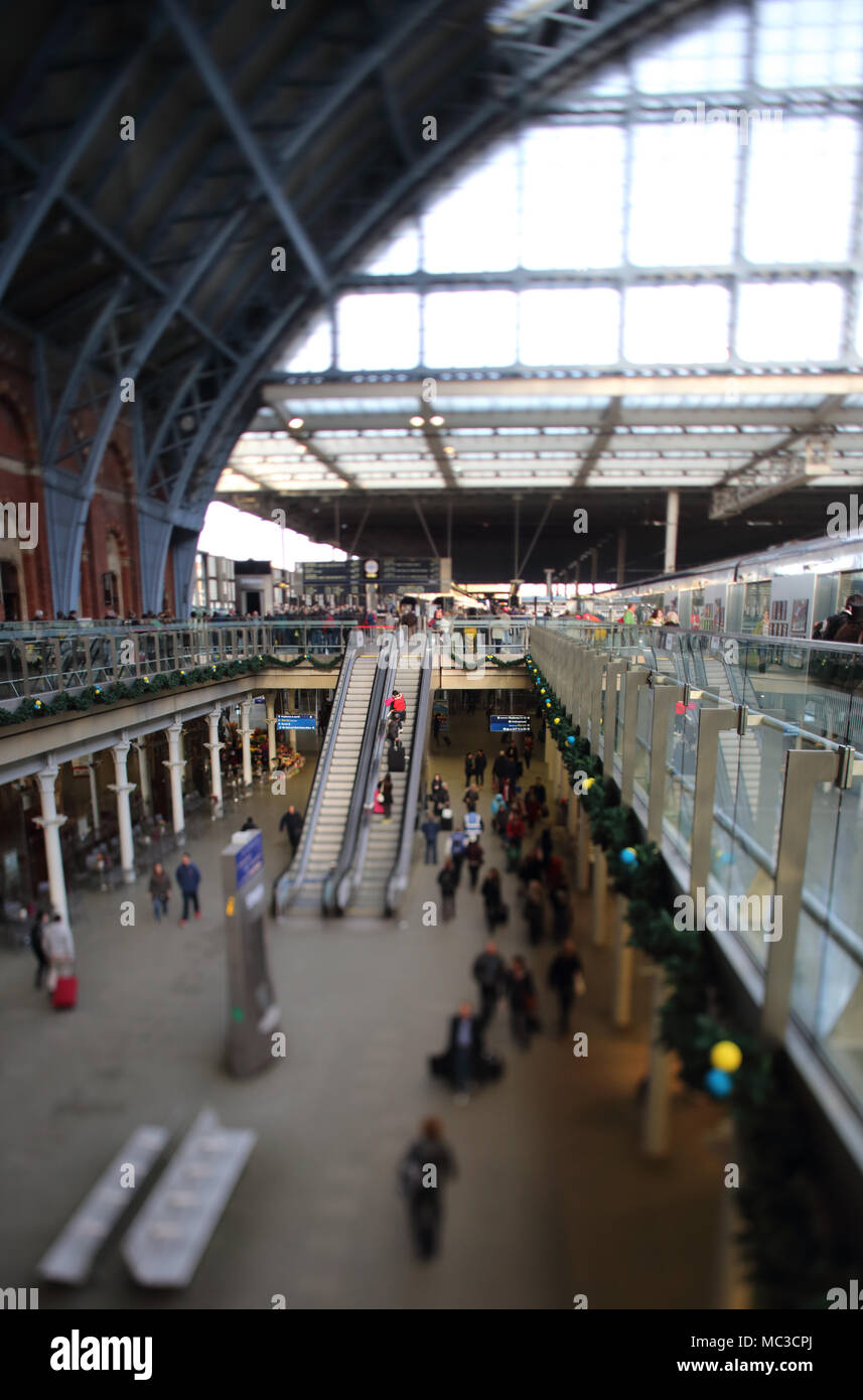 Christmas decorations adorn the Arcade at St Pancras station, London. Photo taken with a 24mm tilt shift lens. Stock Photo