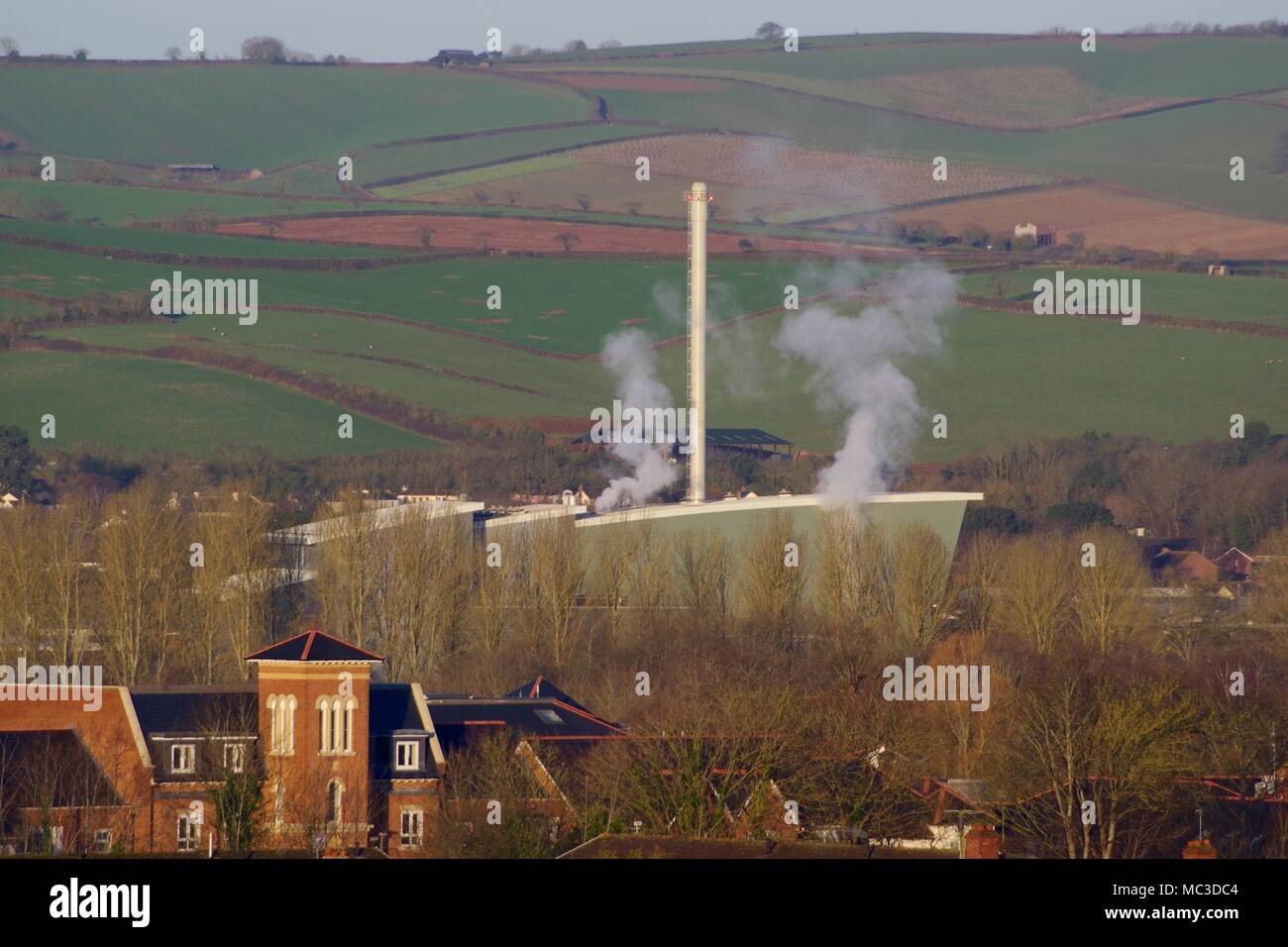 Exeter Incinerator Building, Viridor Waste Management Ltd. Against Patchwork Farming Landscape