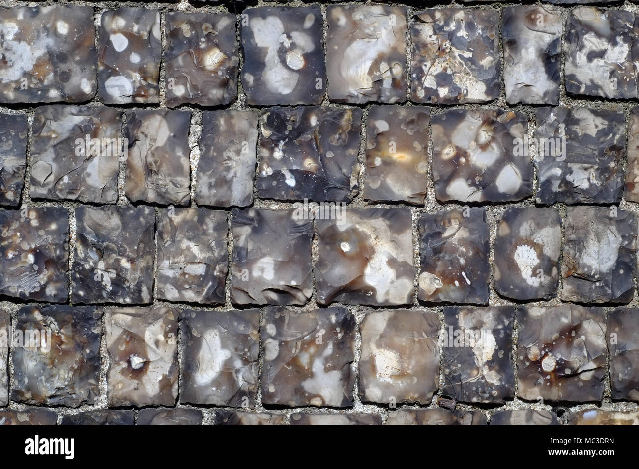 Square napped flints in a Georgian church wall, Lewes, East Sussex, UK Stock Photo