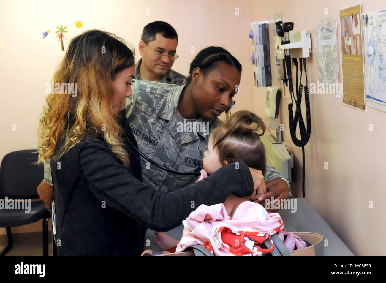 Mckayla Richardson A Student From Radford High School Assists Staff Sgt Adele J Dailey Thomas And Lt Col ron S Thaker From The 15th Medical Operations Squadron Pediatrics Clinic During Career Shadow Day