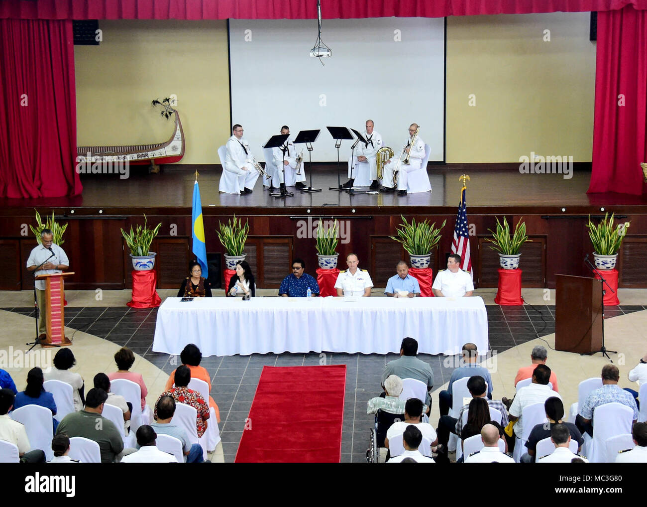 KOROR, Republic of Palau (April 4, 2018) Distinguished attendees sit at the head table during the opening ceremony of Pacific Partnership 2018 (PP18) mission stop Palau April 4. The distinguished attendees included the Honorable Raynold B. Oilouch, Vice President of Palau, the Honorable Faustina Rehuher Marugg, Minister of State of Palau, Paramount Chief Ibedul Yataka M. Gibbons, the Honorable Amy Hyatt, U.S. Ambassador to Palau, Capt. Peter Olive, deputy mission commmander of Pacific Partnership 2018, and Capt. Charles Black, commanding officer of USNS Brunswick. PP18's mission is to work col Stock Photo