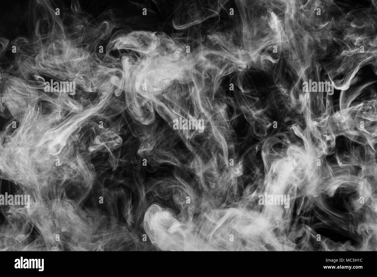 White cloud smoke on black isolated background Stock Photo - Alamy
