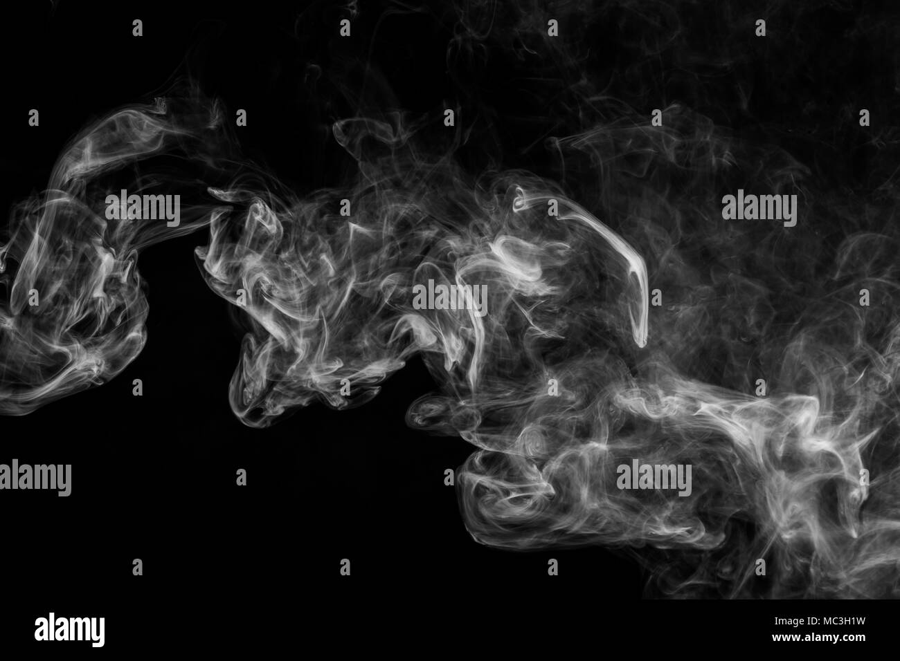 White cloud smoke on black isolated background Stock Photo - Alamy