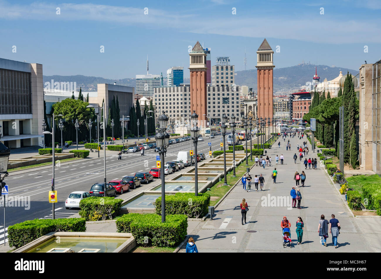 A view down Avinguda de la Reina Maria Cristina towards The Venetian Towers in Barcelona, Spain. Stock Photo