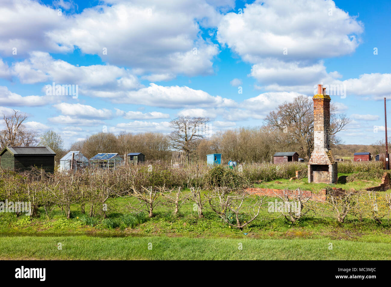 The Old Station, a derelict building with just a brick chimney and hearth and low walls left, Biddenden,, Kent, UK Stock Photo