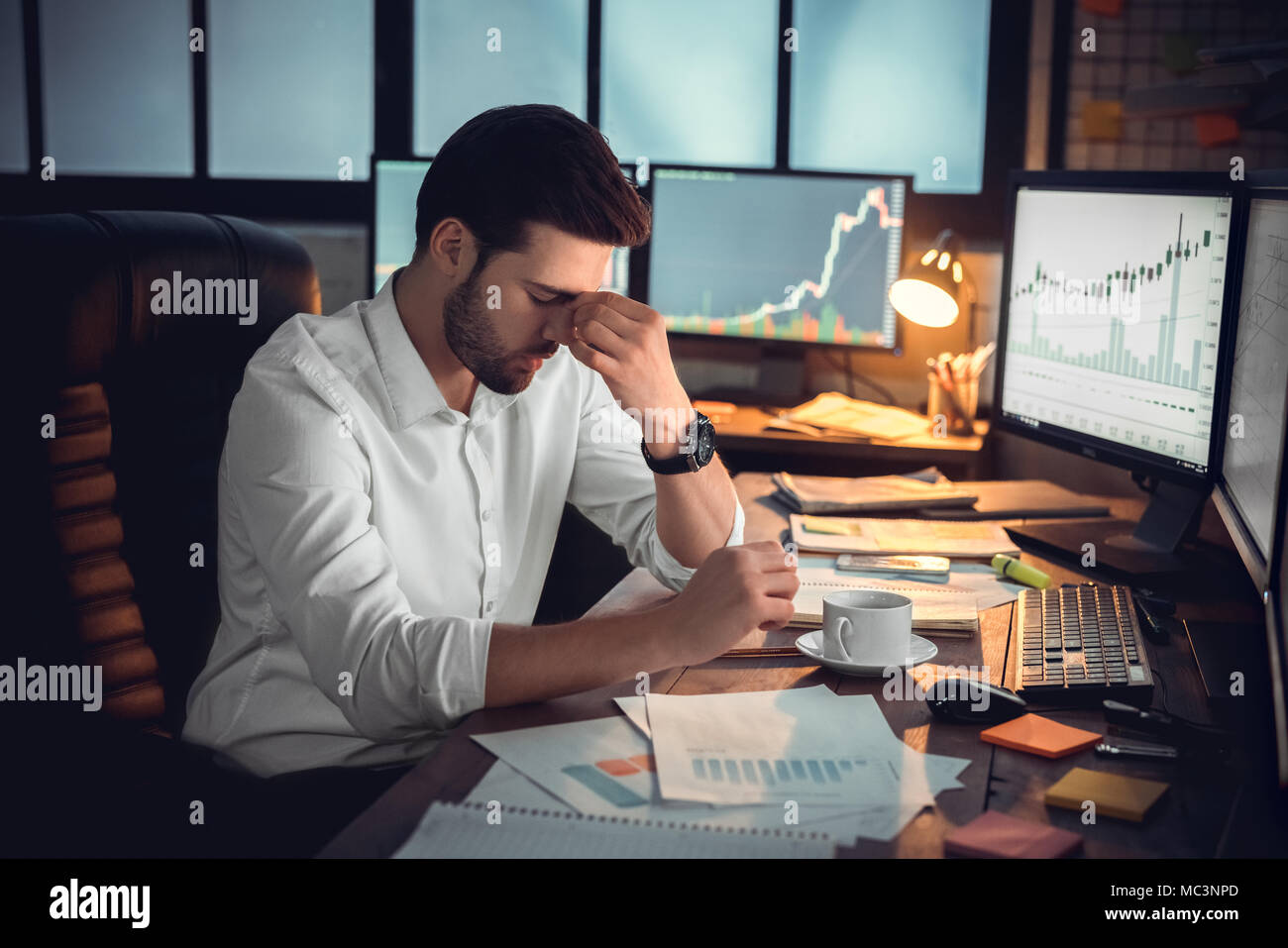 Depressed frustrated trader tired of overwork or stressed by bankruptcy, sad shocked investor desperate about financial crisis or money loss, upset bu Stock Photo