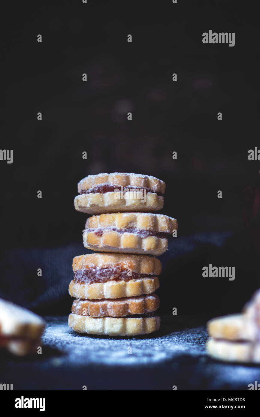 Stack of homemade vanilla jam cookies, on dark background, with copy space Stock Photo Alamy