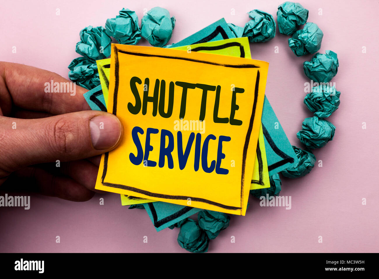 Handwriting text Shuttle Service. Concept meaning Transportation Offer Vacational Travel Tourism Vehicle written Sticky Note Paper Holding by man plai Stock Photo