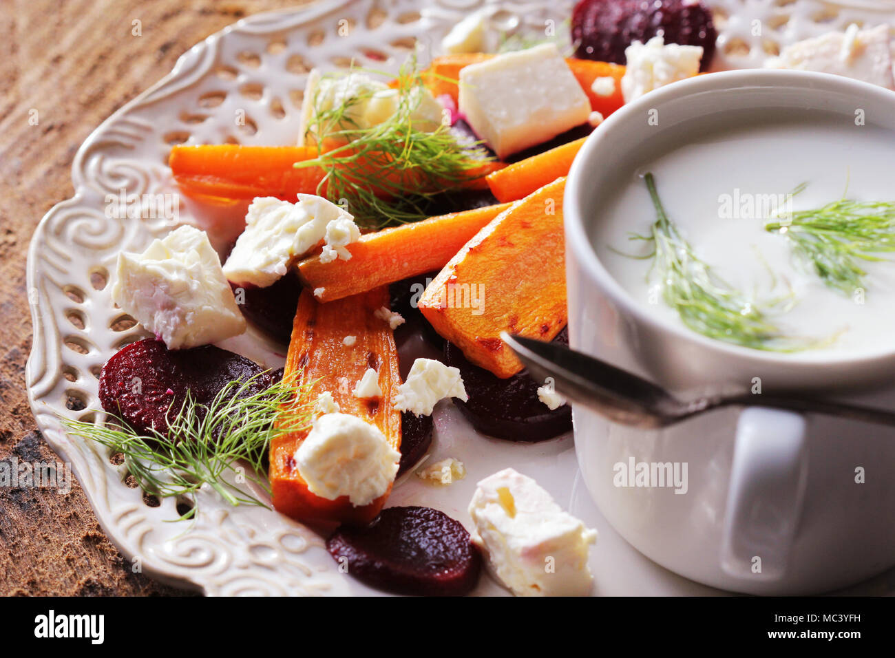 Healthy grilled beet, carrots salad with cheese feta, fennel and Greek