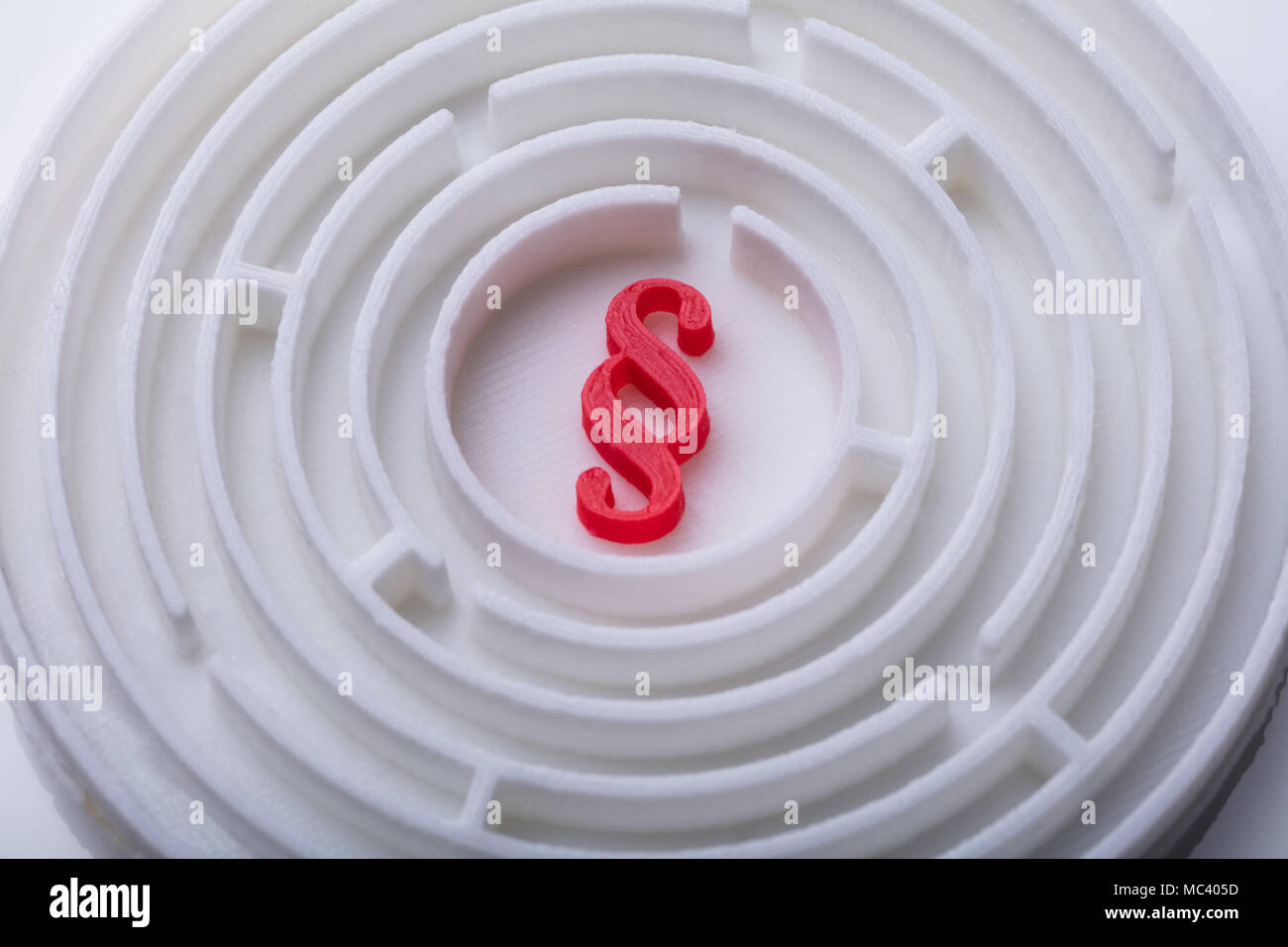 High Angle View Of Maze With Red Paragraph Symbol In Center Stock Photo