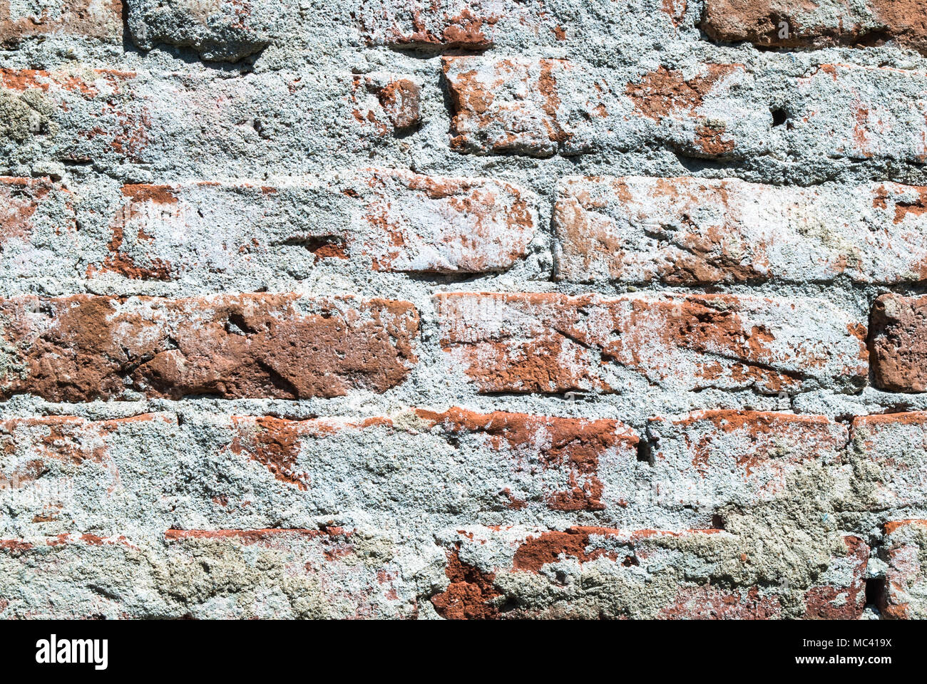 Red bricks and mortar wall texture on old house on daylight, close up Stock Photo Alamy