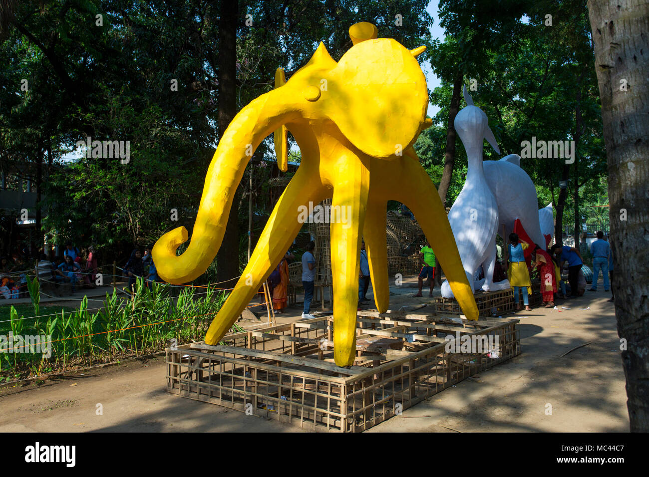 Dhaka, Bangladesh. 12th Apr, 2018. Dhaka University Fine Arts (FFA) student paints a mural to celebrate upcoming Bengali New Year 1425 in Dhaka. Preparations are underway for the festivities Pahela Boishakh. People make crafts for the celebrations. Pahela Boishakh (the first day of the Bangla month) can be followed back to its origins during the Mughal period when Emperor Akbar introduced the Bangla calendar to streamline tax collection while in the course of time it became part of Bengali culture and tradition. Credit: Jahangir Alam Onuchcha/Alamy Live News Stock Photo