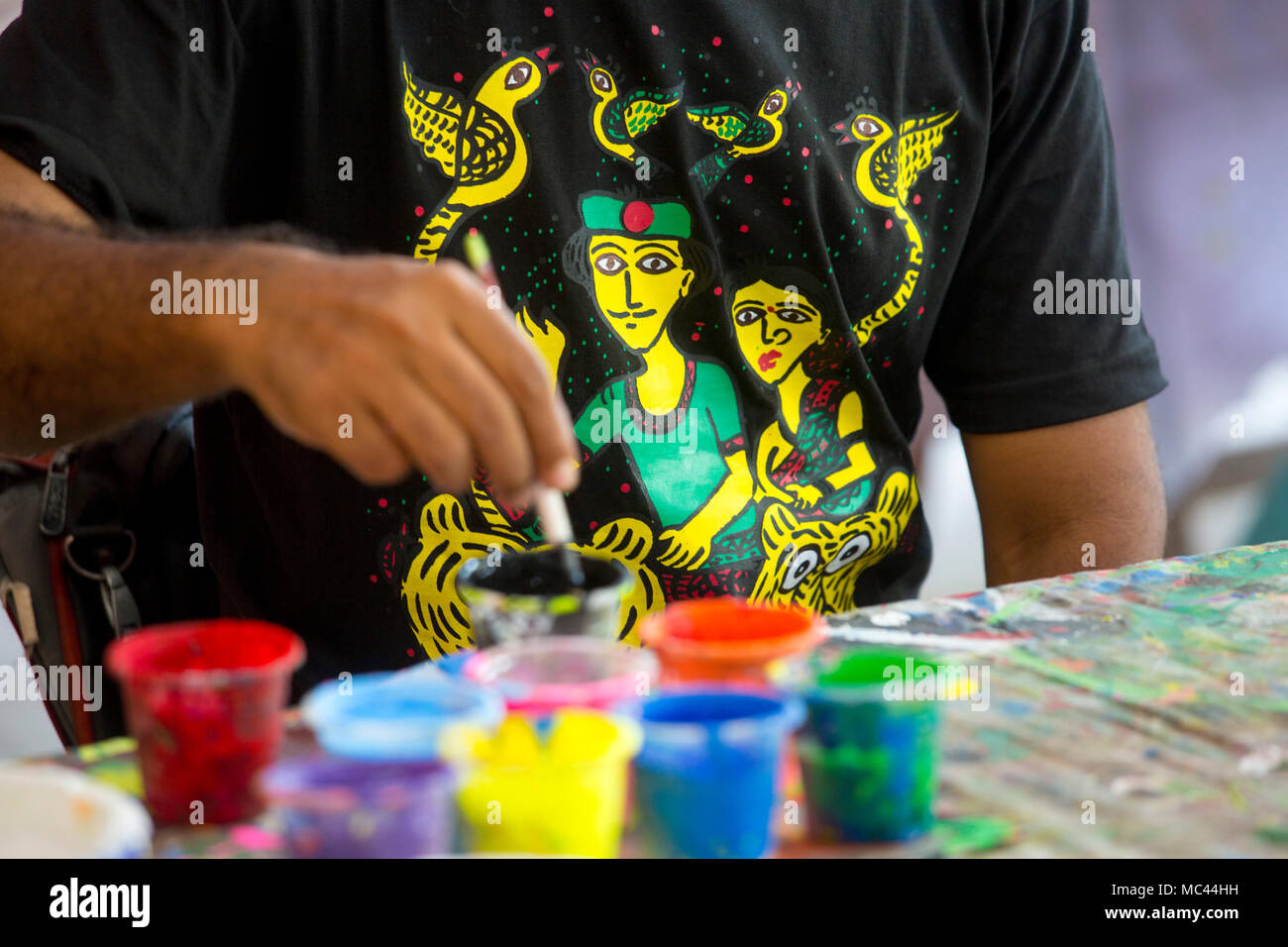 Dhaka, Bangladesh. 12th Apr, 2018. Dhaka University Fine Arts (FFA) student paints a mural to celebrate upcoming Bengali New Year 1425 in Dhaka. Preparations are underway for the festivities Pahela Boishakh. People make crafts for the celebrations. Pahela Boishakh (the first day of the Bangla month) can be followed back to its origins during the Mughal period when Emperor Akbar introduced the Bangla calendar to streamline tax collection while in the course of time it became part of Bengali culture and tradition. Credit: Jahangir Alam Onuchcha/Alamy Live News Stock Photo